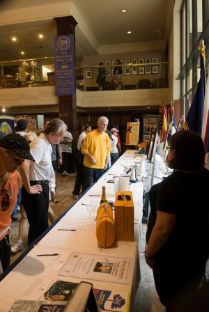 Members and runners peruse silent auction items, with proceeds going to the Eric Friedheim National Journalism Library.